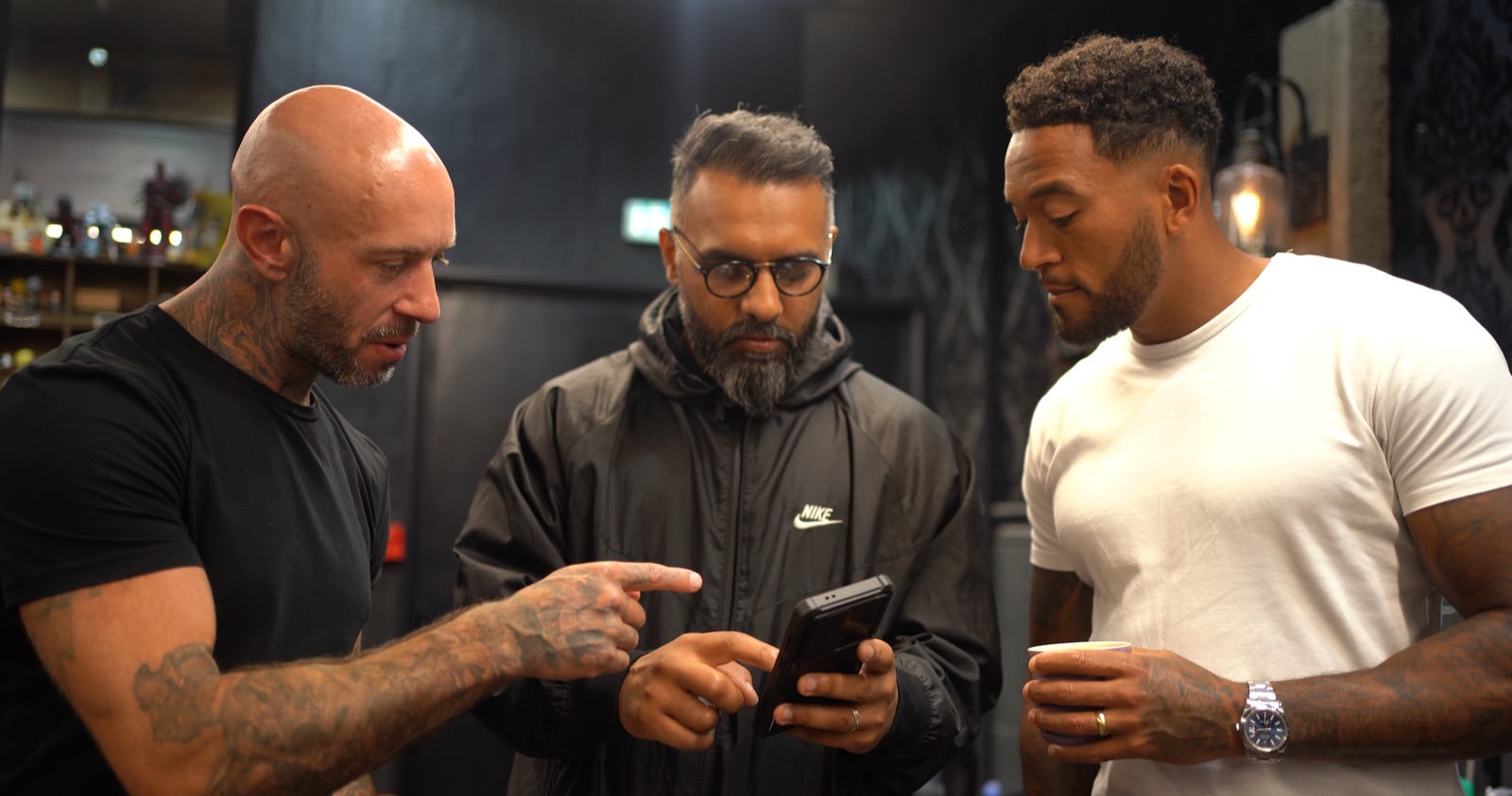 Andy with two mentees in a Vivid Ink studio