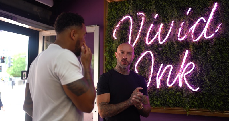 Andy at Vivid Ink — neon brand wall
