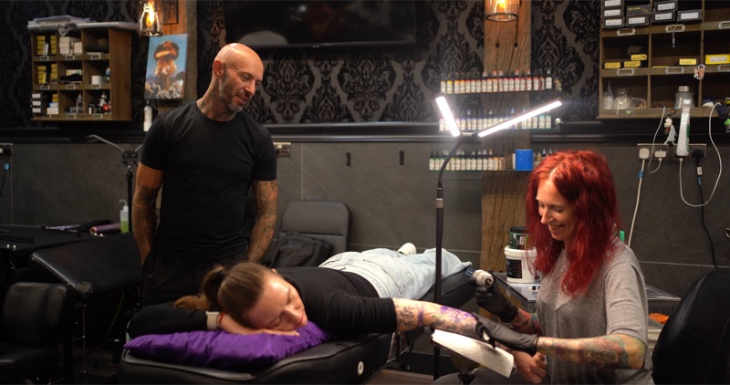 Andy supervising a tattoo session