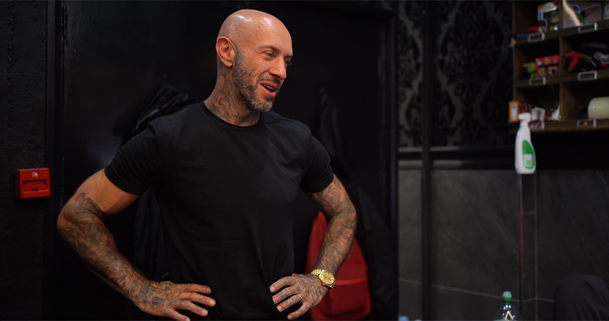 Andy laughing inside a Vivid Ink studio